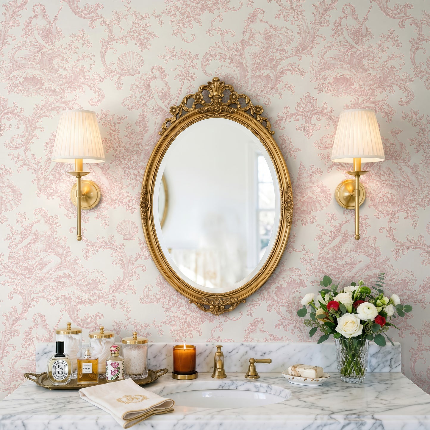 Pink Goddess Toile Wallpaper in a romantic bathroom with gold oval mirror and marble vanity