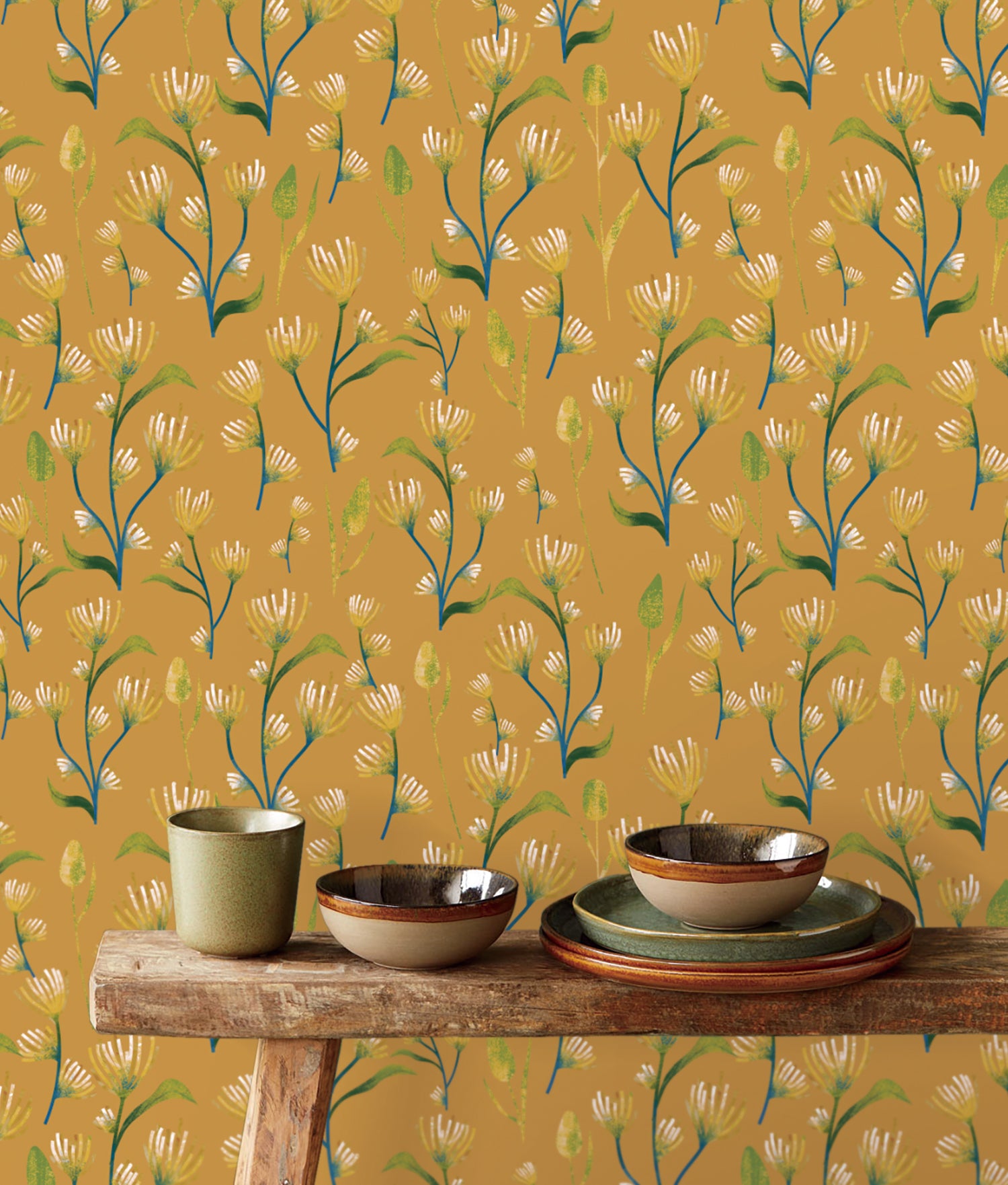 Earthy Yellow Abstract Flower Peel & Stick Wallpaper against a set of plates| RollsRolla
