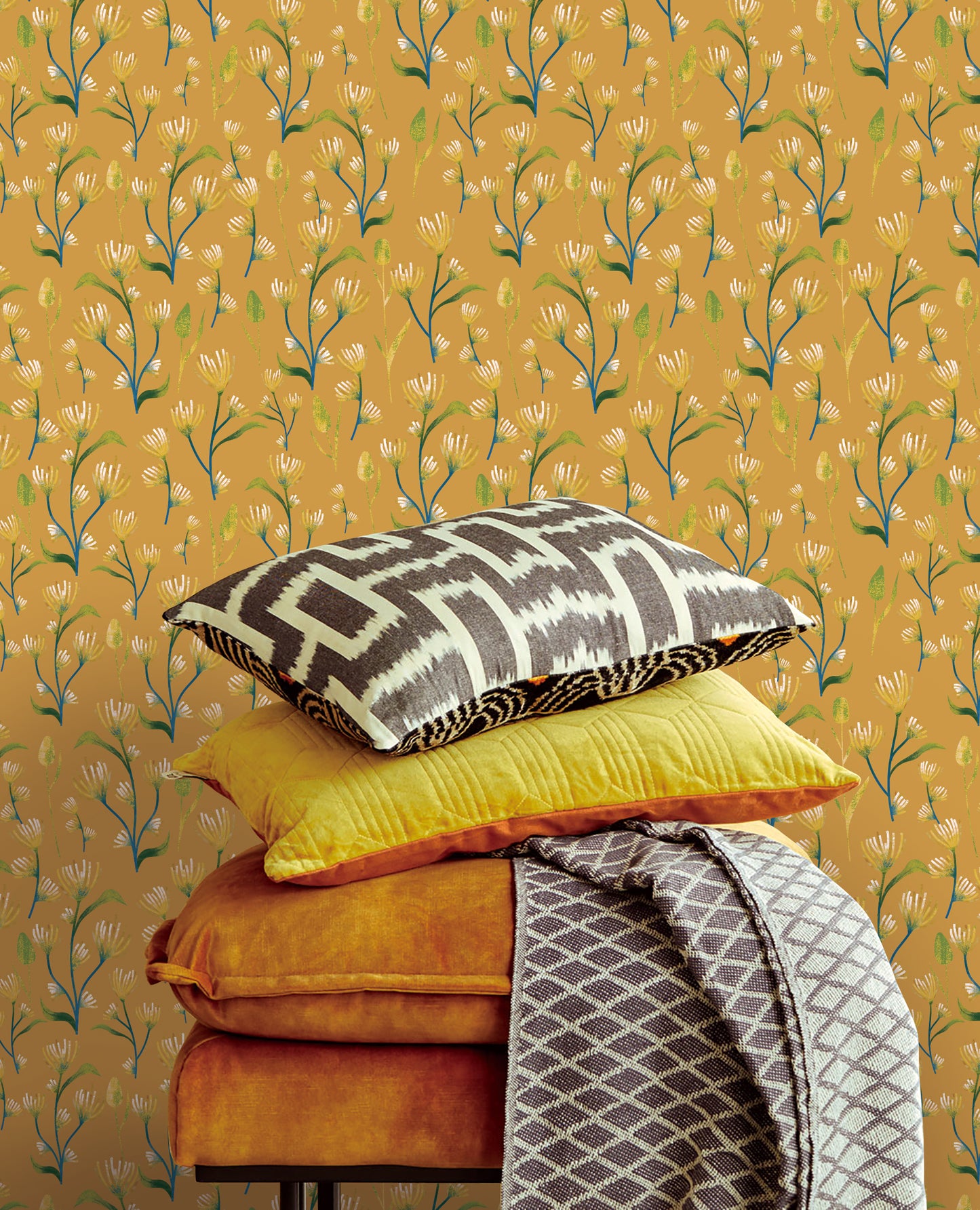 Earthy Yellow Abstract Flower Peel & Stick Wallpaper against a pillow stack| RollsRolla